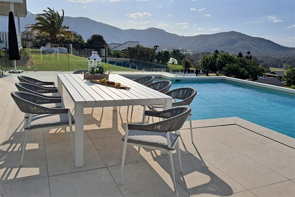 Outdoor dining set with 8 chairs in white and grey.