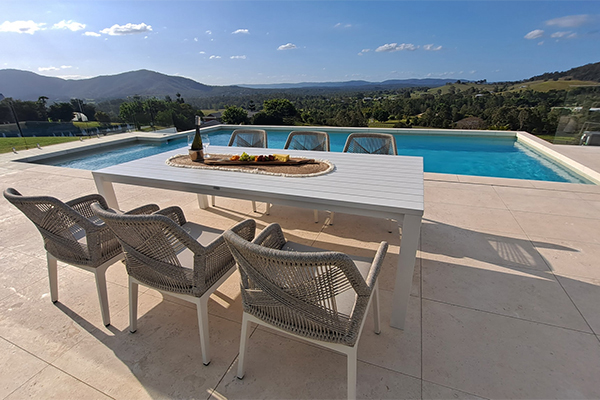 outdoor dining set by poolside